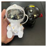 رقص نور لیزری مدل کهکشانی طرح فضانورد نشسته