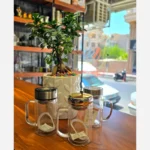 دمنوش‌ساز شیشه‌ای درب آینه‌ای دسته‌دار با فیلتر استیل - Image 6